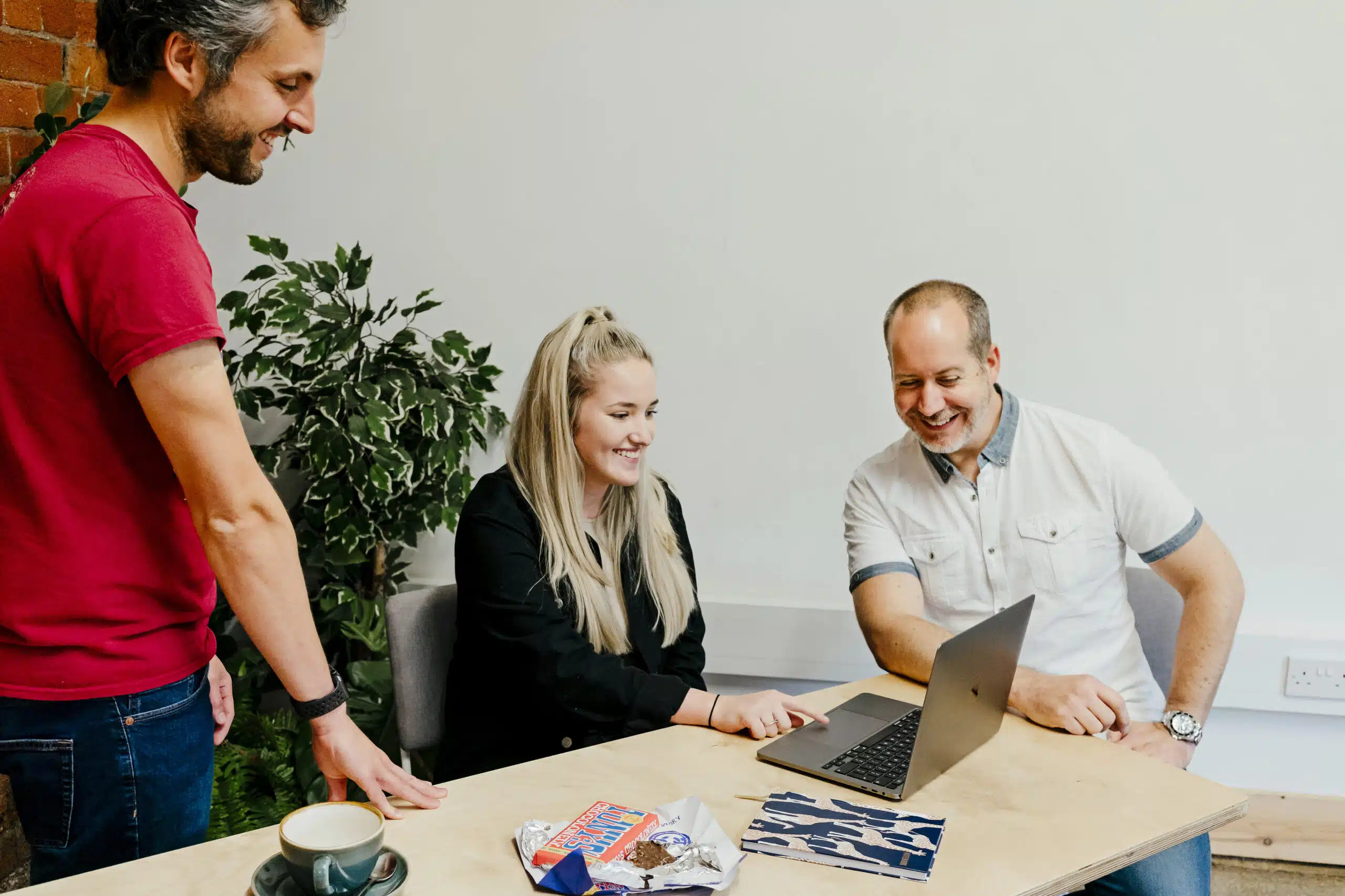 Cloud Nexus Team working on a laptop using Microsoft 365
