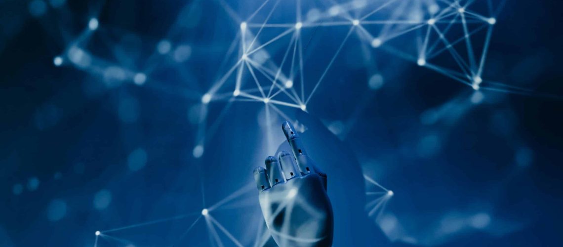 Free A robotic hand reaching into a digital network on a blue background, symbolizing AI technology. Stock Photo